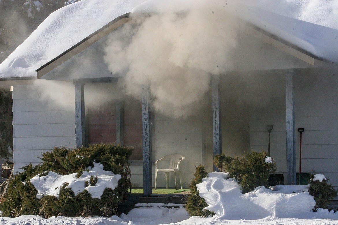 A house on Nevada Avenue in Libby was filled with smoke by a cooking fire, and the resident had to be treated for smoke inhalation Friday. (Rima Austin/The Western News)