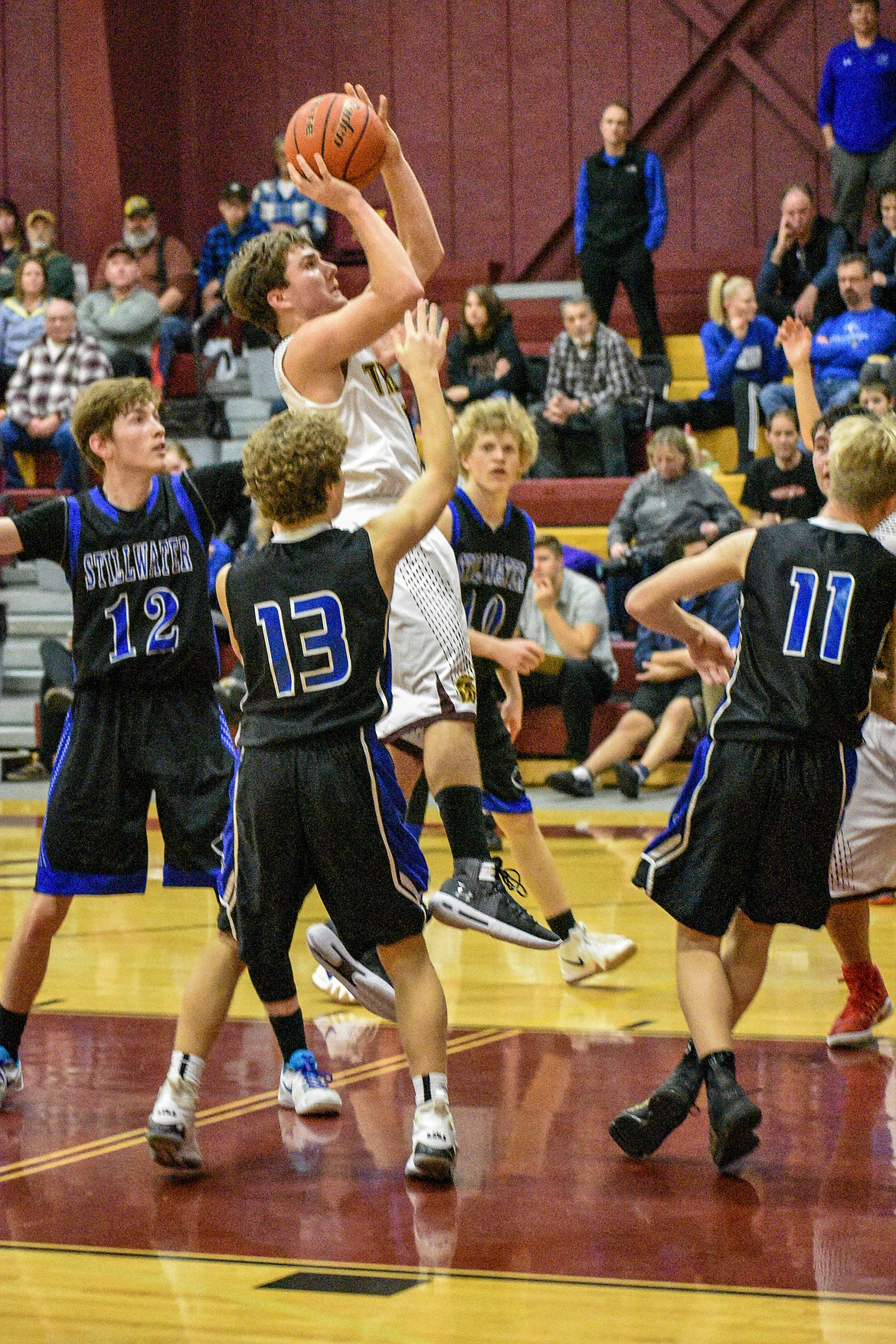 Troy junior Ricki Fisher makes the first points of the fourth quarter against Stillwater Saturday. (Ben Kibbey/The Western News)