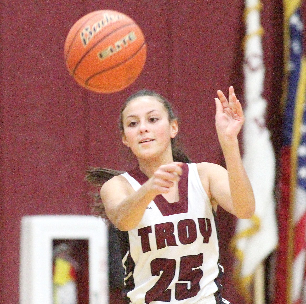 Junior guard Isabel Ramirez passes to Annie Day in first quarter vs. Lady Cougars Saturday. (Paul Sievers/TWN)