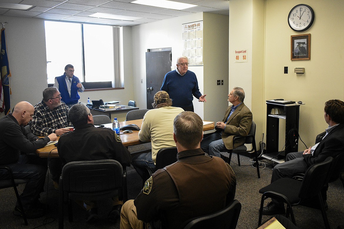 Montana Public Service Commission Vice Chair Bob Lake addresses Lincoln County officials, Flathead Electric Cooperative representatives and area manager for Frontier Communications Bob Trombley during a meeting at the Lincoln County Courthouse Thursday. (Ben Kibbey/The Western News)