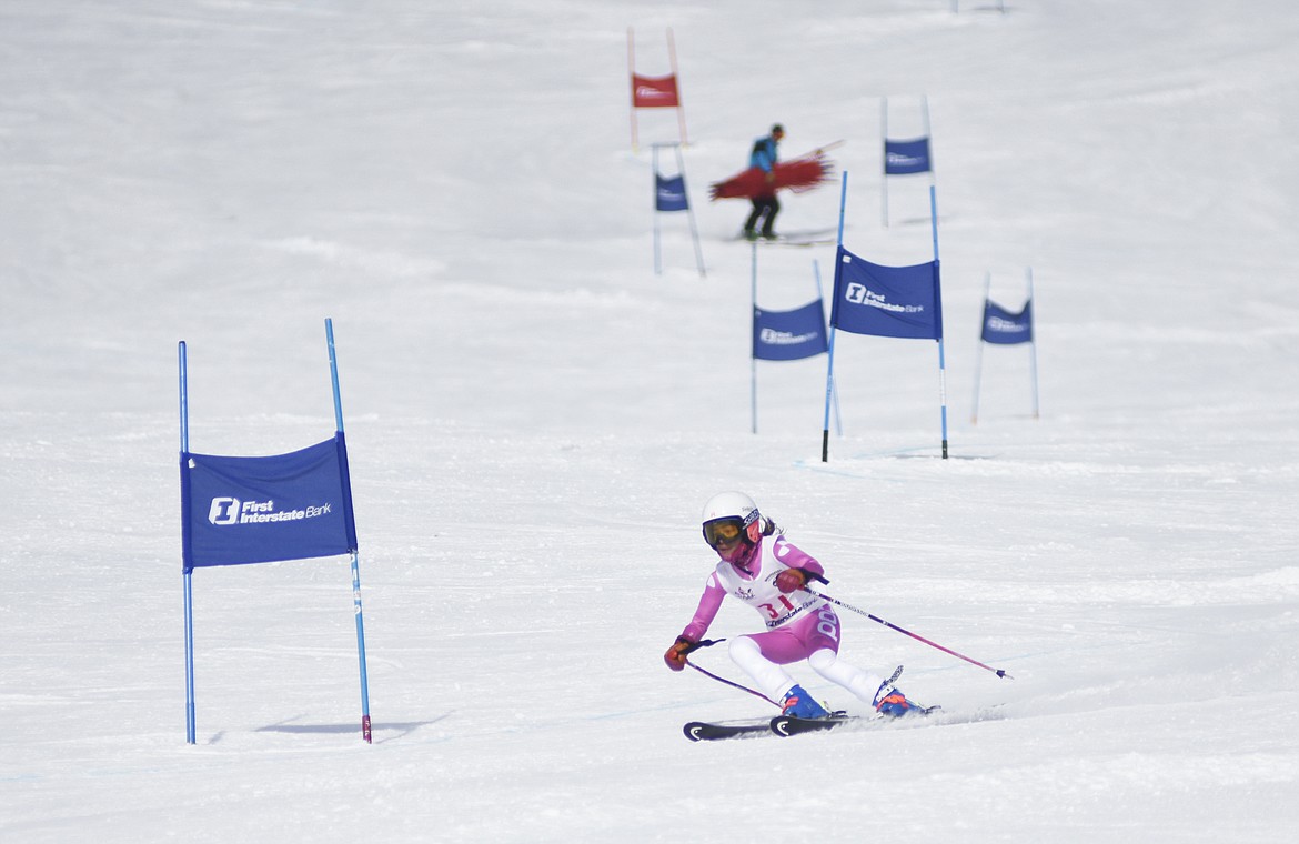 Isla Bougard-Duncan makes the final turn during the final day of the Sportsman Ski Haus Northern Division U14 Qualifier slalom races at Whitefish Mountain Resort on Monday. (Daniel McKay/Whitefish Pilot)