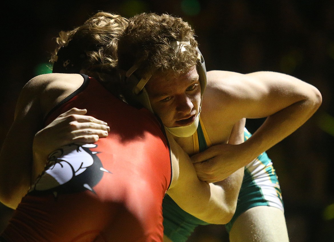 Lakeland&#146;s Lucas Williams wrestles with Sandpoint&#146;s Casey Olesen in the 120-pound match Friday.