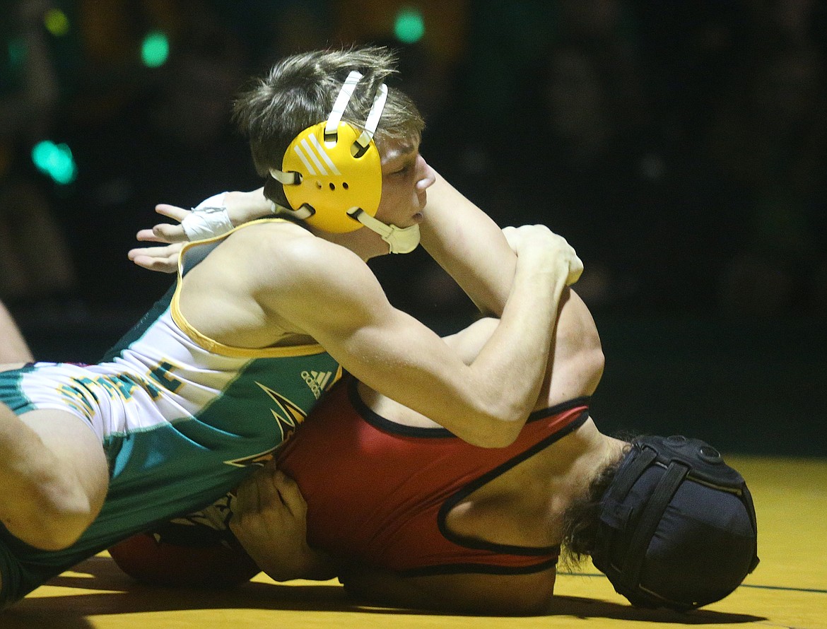 Lakeland&#146;s Riley Siegford turns over Jake Ryan&#146;s shoulder in the 132-pound match Friday night at Battle for the Paddle.