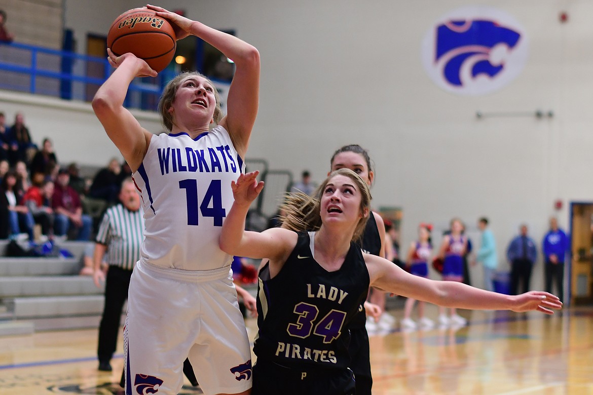 Josie Windauer goes up over Polson's Karly Lawson Tuesday. (Jeremy Weber photo)