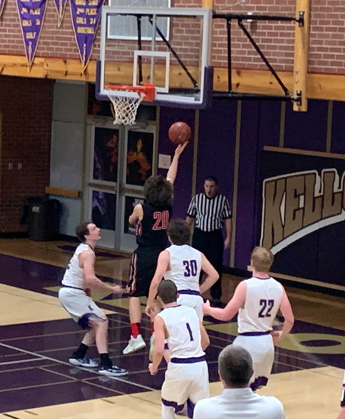 Wallace's Triston Neubauer drops in an easy lay-in for 2 of his 13 points.