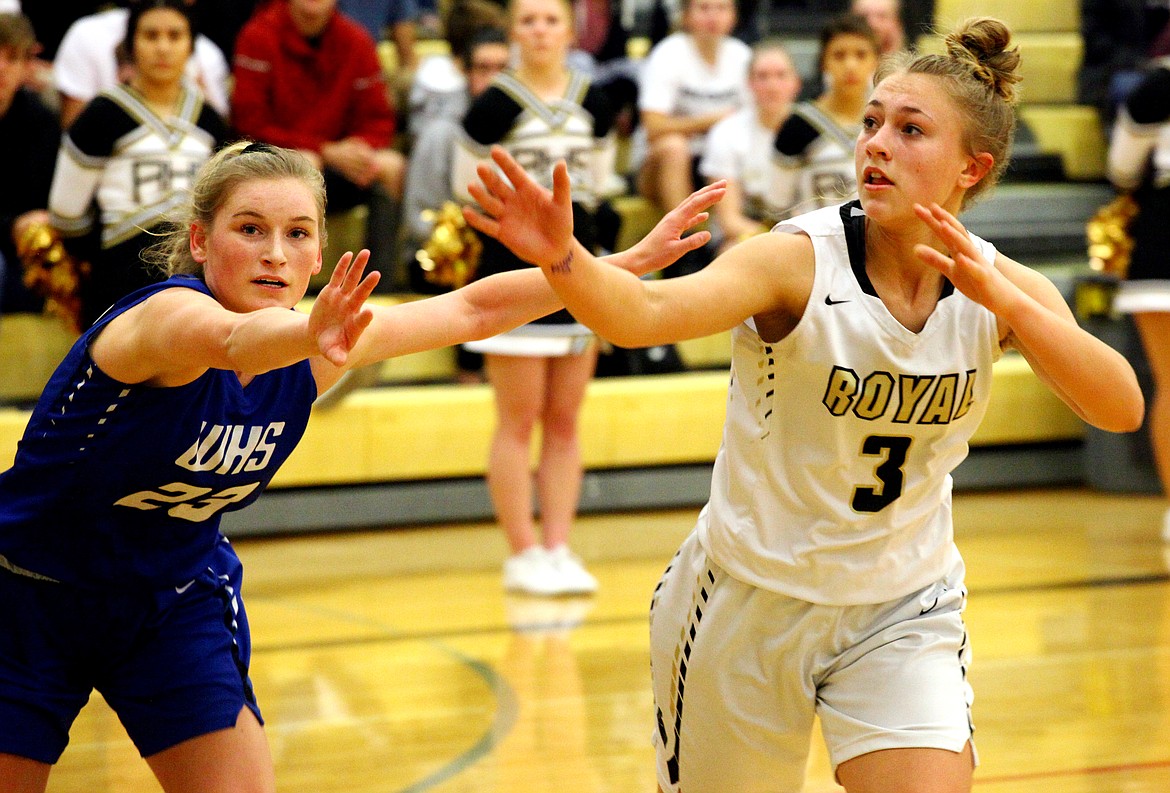 Rodney Harwood/Sun Tribune
Royal&#146;s Emma Wilhelm (3) works against Warden defendier Aubree Skone (23) to take the inbounds pass during the first half of Saturday&#146;s SCAC East game.