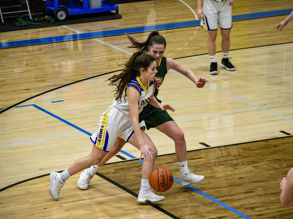 Libby senior Alli Collins drives into the paint to score, giving the Lady Loggers an 18-8 lead late in the first half against Whitefish Saturday. (Ben Kibbey/The Western News)
