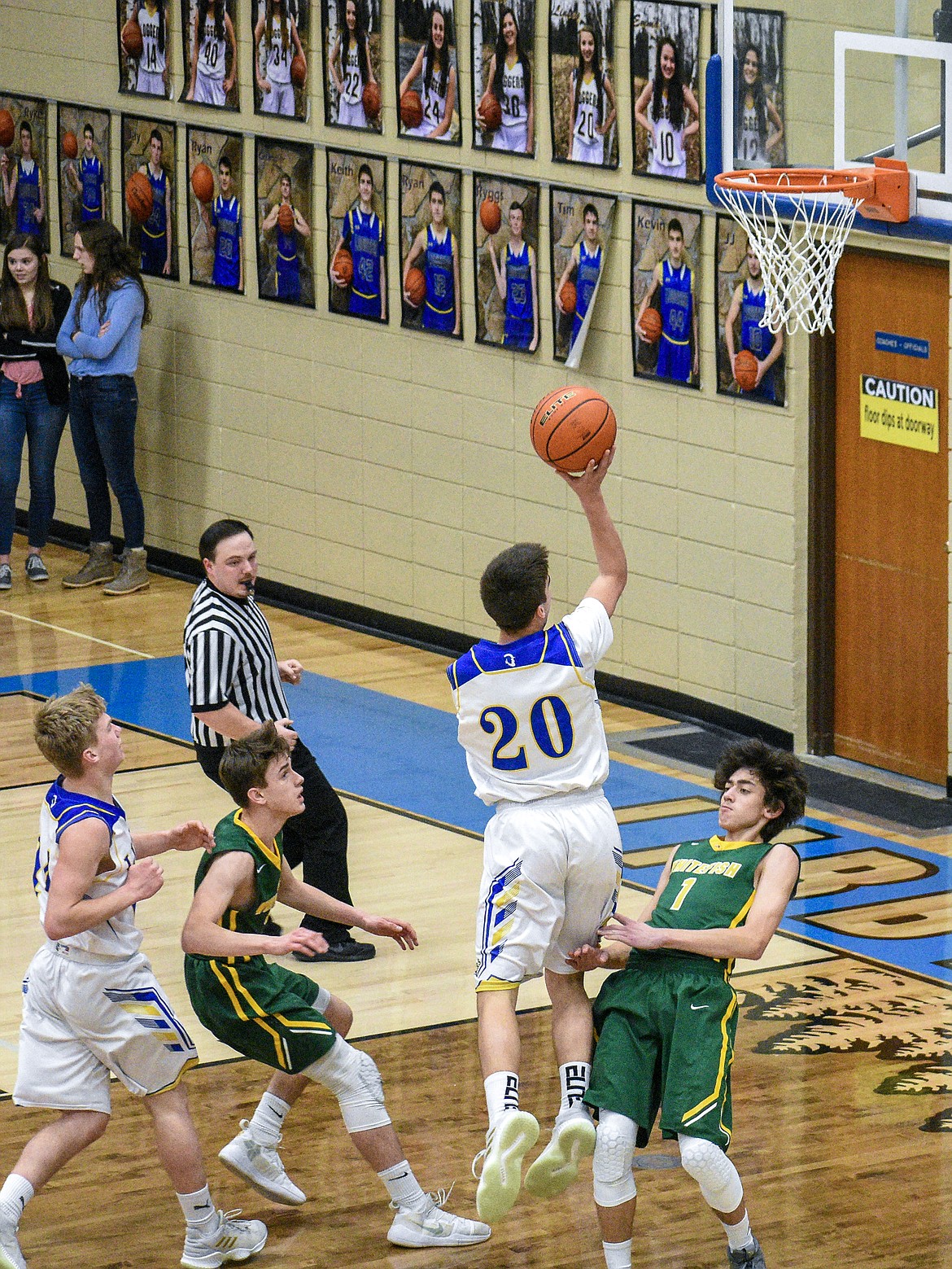 After stealing the ball off the Whitefish offense as they passed it around the arc in the final seconds of the first half, Libby junior Ryan Goodman makes a layup Saturday. Goodman followed with one from the free throw line off the foul by Bulldog sophomore Jayce Cripe, making the score 20-18, Whitefish.. (Ben Kibbey/The Western News)