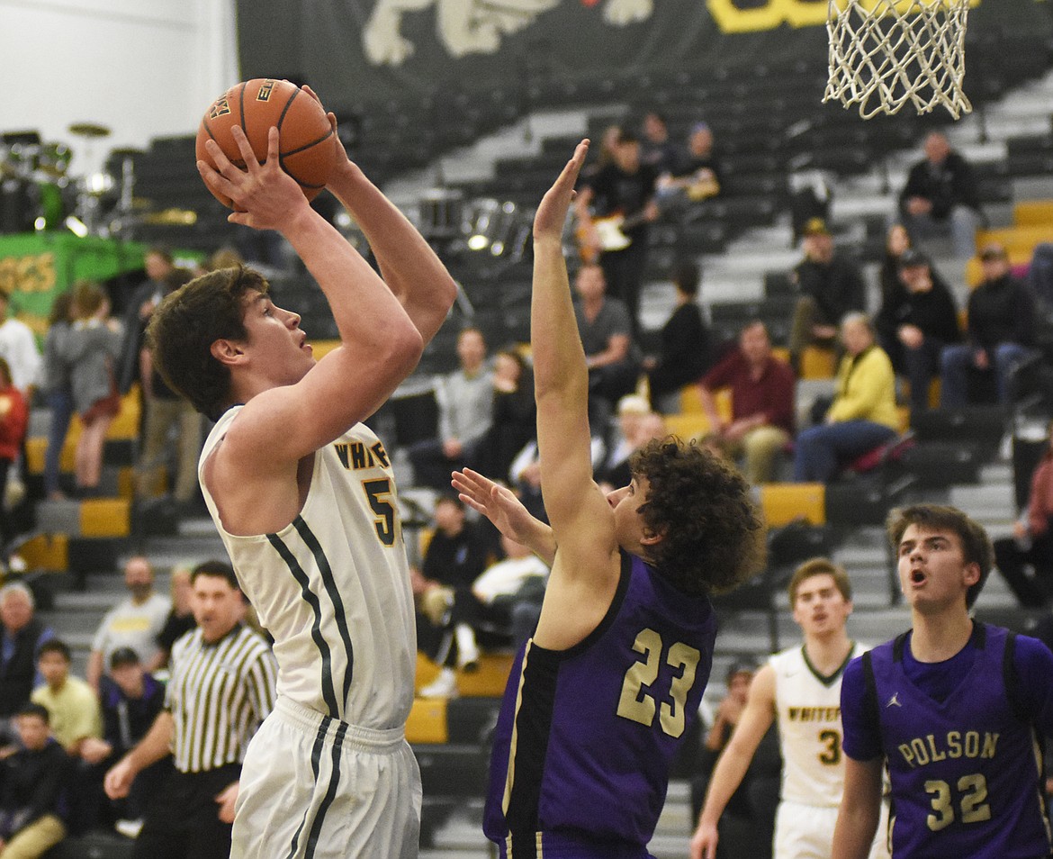 Dillon Botner rises through the lane during the Dogs&#146; home win over Polson on Friday. (Daniel McKay/Whitefish Pilot)