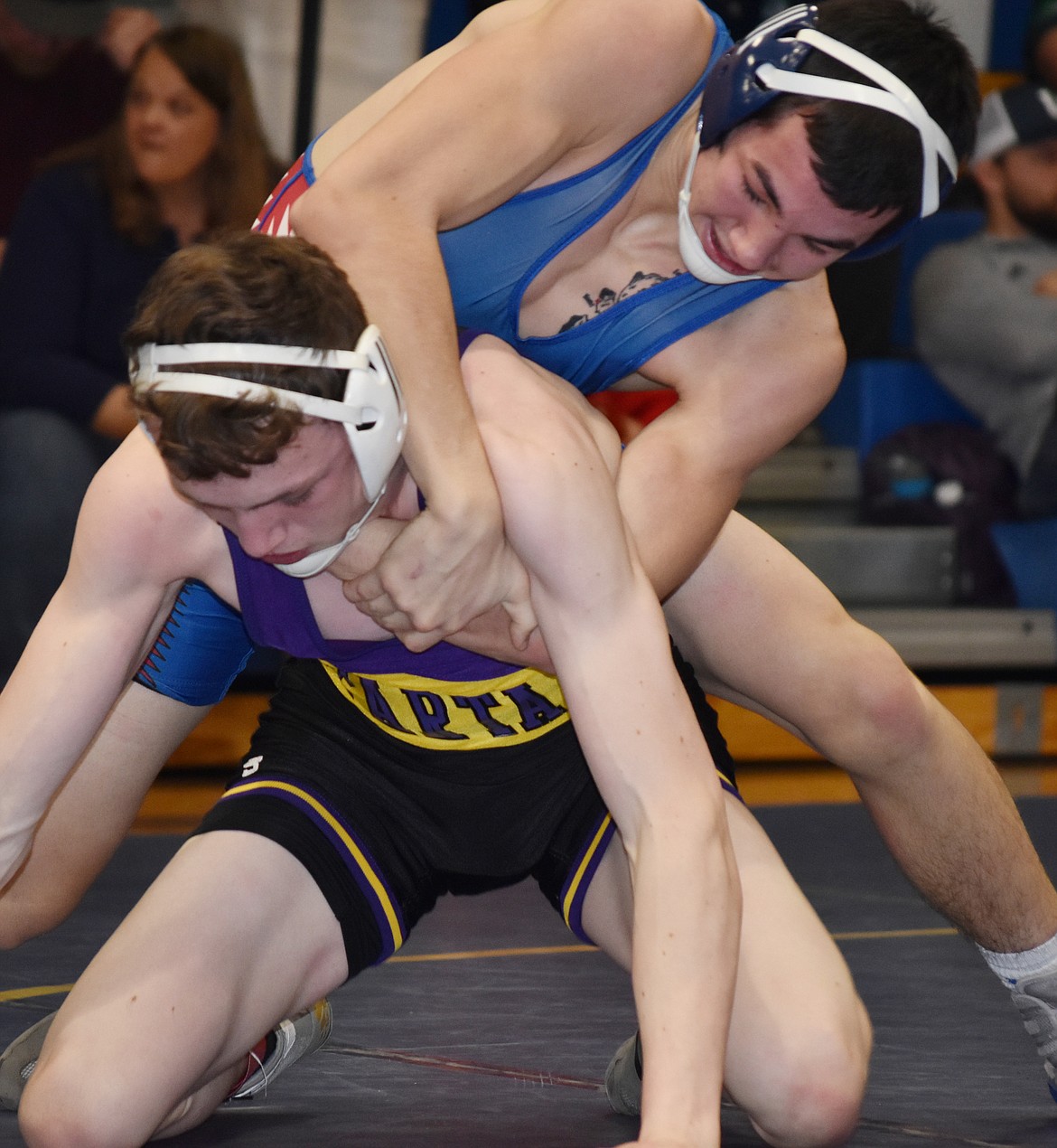 Clark Fork Mountain Cat Isaiah Kovalsky, in blue, placed first in the 145-pound class at the Ted Kato Invitational last Saturday, Jan. 19 at Thompson Falls High School. (Joe Sova/Mineral Independent)