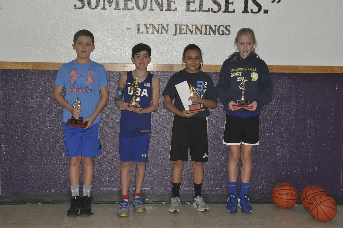 Place winners in the 10- to 11-year-old division of the district Elks Hoop Shoot, left to right, are Jake McCarthy, second, boys; Isaac Lemere, first, boys; Samantha Rensvold, first, girls; and Gabi Hannum (Thompson Falls), second, girls. Lemere and Rensvold qualified for the state Elks Hoop Shoot set for Feb. 2 in Livingston (Ashley Fox photos/Mineral Independent)