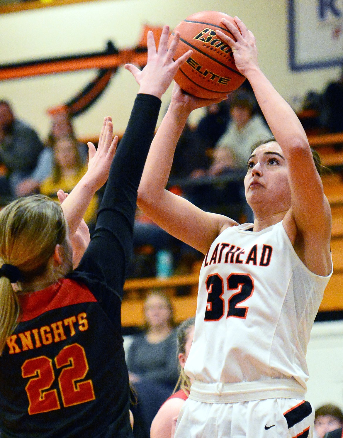 Flathead&#146;s Taylor Henley (32) looks to shoot with Missoula Hellgate&#146;s Bailee Sayler (22) defending at Flathead High School on Thursday. (Casey Kreider/Daily Inter Lake)