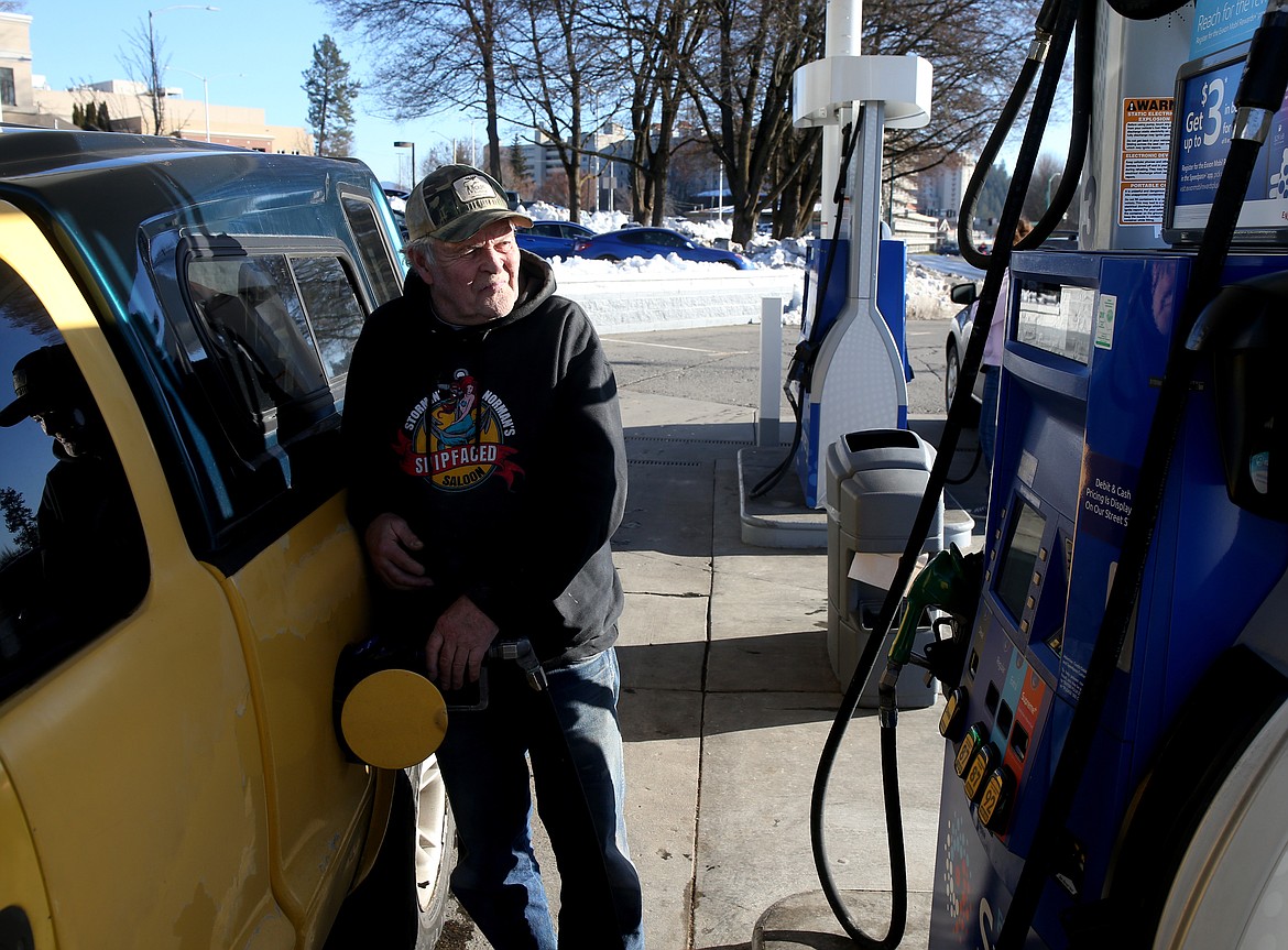 LOREN BENOIT/Press
Coeur d&#146;Alene resident Dennis Ward fuels his vehicle Tuesday at Mobil on Northwest Boulevard.