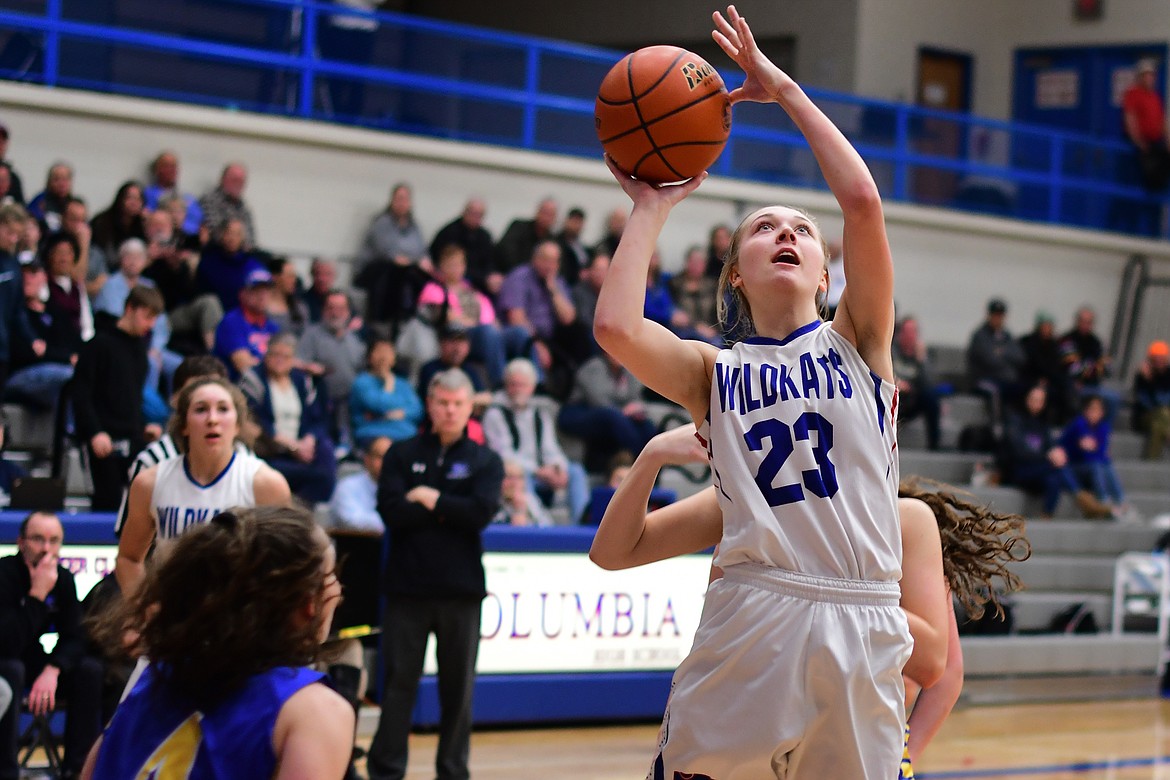 Ryley Kehr takes the ball up for two of her 16 points against Libby Thursday. (Jeremy Weber photo)