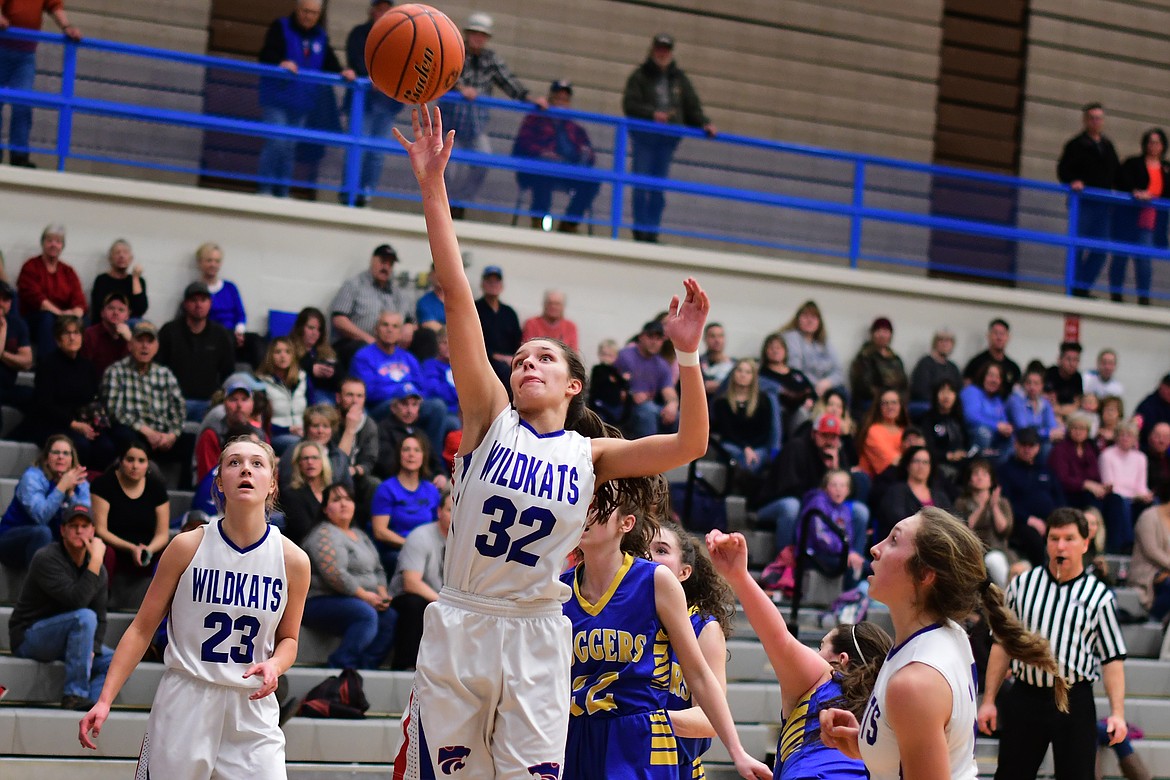 Madysen Hoerner puts back an offensive rebound against the Lady Loggers Thursday. (Jeremy Weber photo)