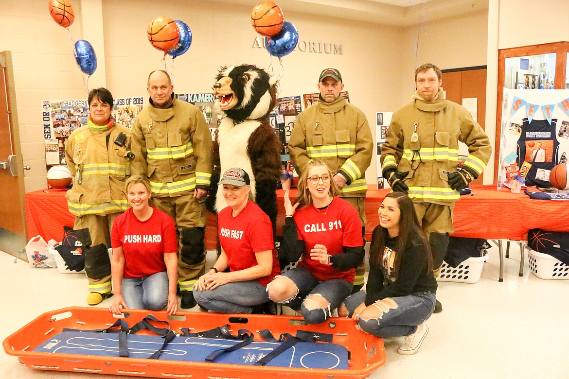 Photos by MANDI BATEMAN
Participants in the Hands Only CPR demonstration at the Jan. 25 BFHS basketball game included, back row from left: Leonor Saldana, Tony Rohrwasser, Buddy Badger, Allen Merritt, and Kris Lummus; front row: Alana Temple, Wanda Wilkerson, Jerzie Pluid and Leilani Ram. Not pictured: Wayne Wilkerson, Barry Blackmore, Janice Tucker, and Maurine Blackmore.