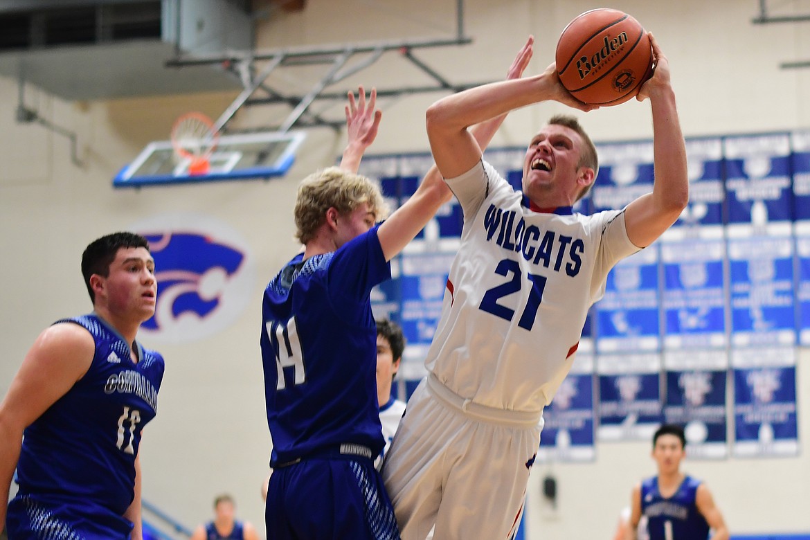 Danny Henjum takes a fadeaway jumper against Blue Devil Caleb Warnken Saturday. (Jeremy Weber photo)