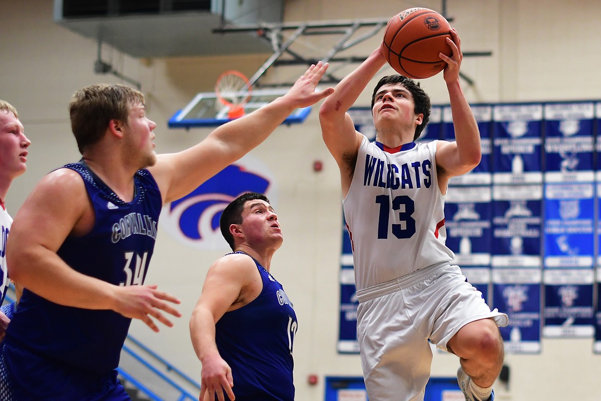 Dillon Shipp shoots over Blue Devil Garrett Brown Saturday. (Jeremy Weber photo)