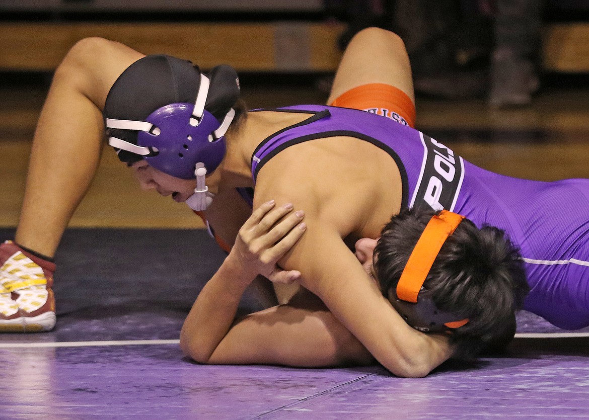 Polson&#146;s Caleb Pierre pins his Ronan opponent in last Thursday&#146;s dual at Polson High School. (Bob Gunderson photos/Lake County Leader)