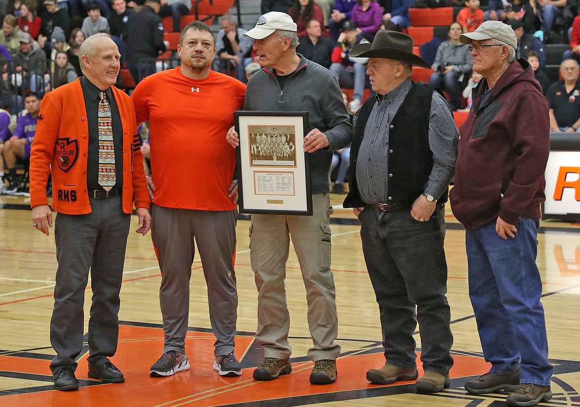 The 1960 Chief basketball team captured the state title. Members of the championship team were honored at the Wall of Fame ceremony at the Ronan Activities Center. Pictured, from left, are Gayle Decker, Ronan Booster Club; Rich Janssen, Ronan School District 30 board member; and 1960 team members Nels Jensen, Roger Cheff and Ron Richwine. Attending but not pictured: Harold Fullerton. (Bob Gunderson/Lake County Leader)