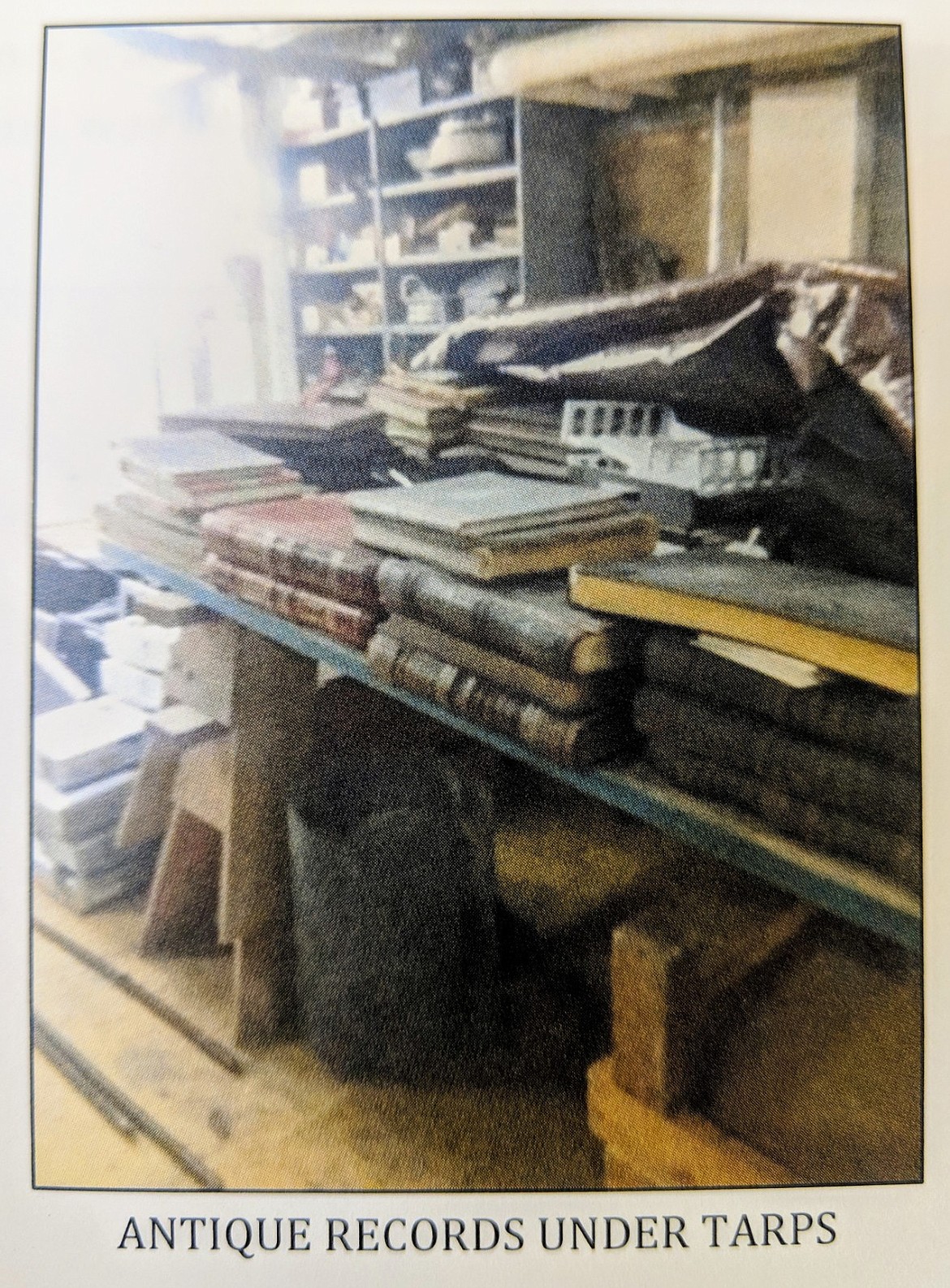 Courtesy photo
Antique records stored in the Shoshone County Sheriff&#146;s Office covered with a tarp to protect them from water damage.