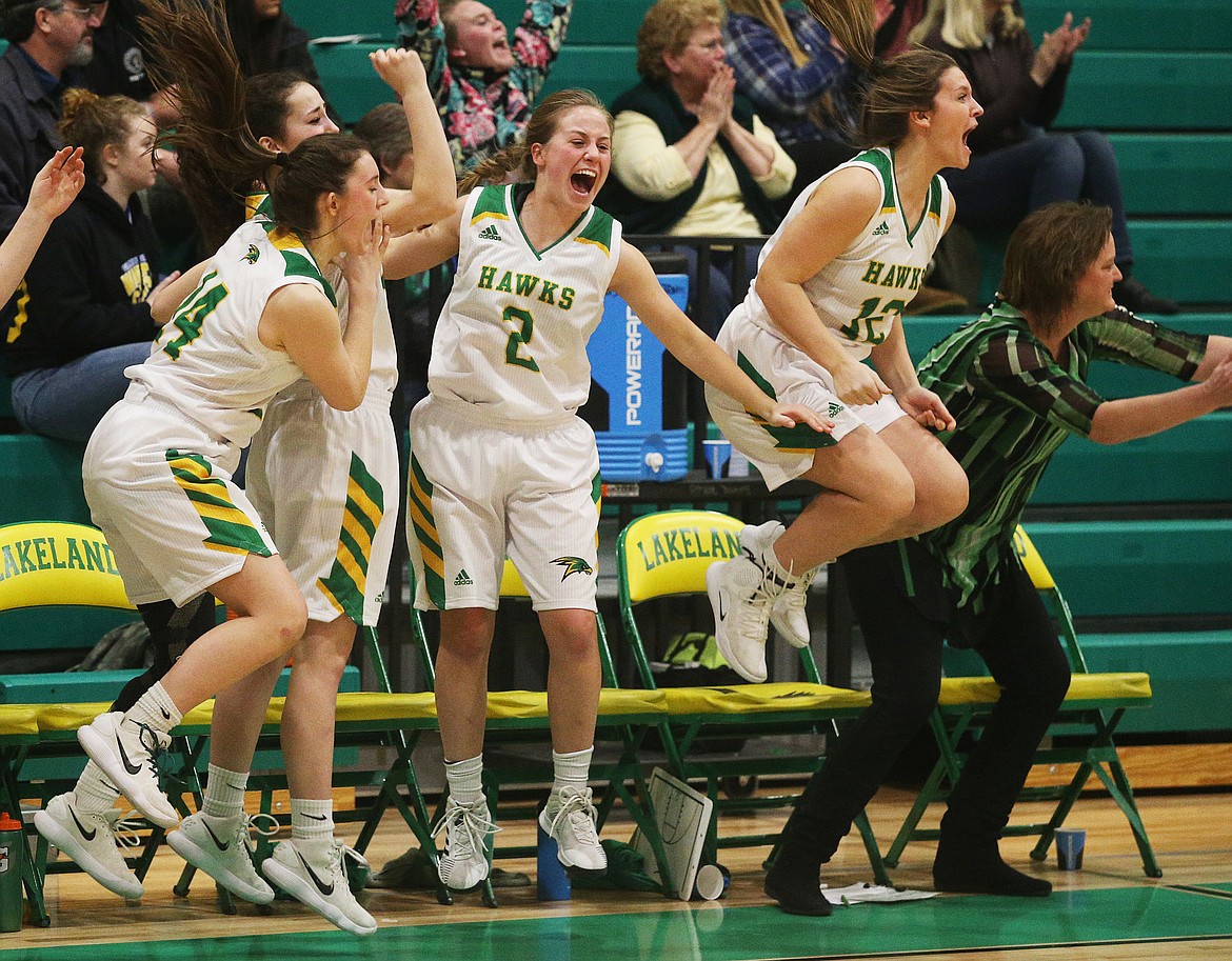 LOREN BENOIT/Press
Lakeland&#146;s Sarah Boyer (2) celebrates next to her teammates after the Hawks defeated Moscow 42-34 for the 4A Region 1 championship Friday night in Rathdrum.