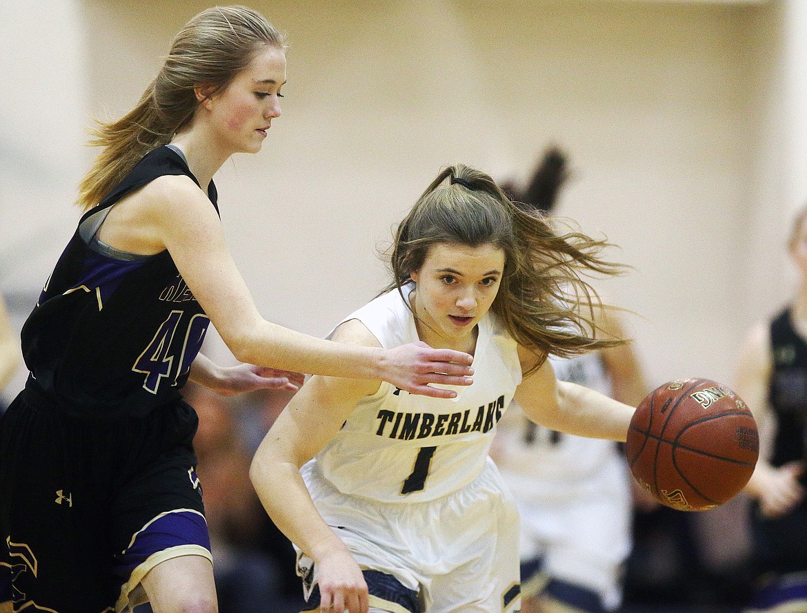 Timberlake&#146;s Taryn Soumas dribbles the ball down the court while defended by Kellogg&#146;s Grace Nearing. (LOREN BENOIT/Press)