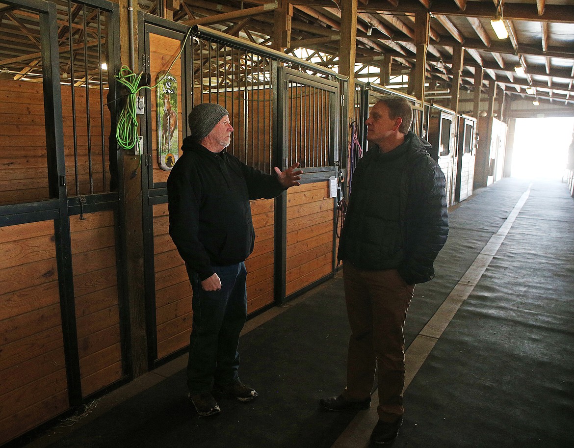 Ranch Manager Mike Pippin gives a ranch tour to new Idaho Youth Ranch CEO Scott Curtis Thursday at The Stables at Mica Meadows. (LOREN BENOIT/Press)