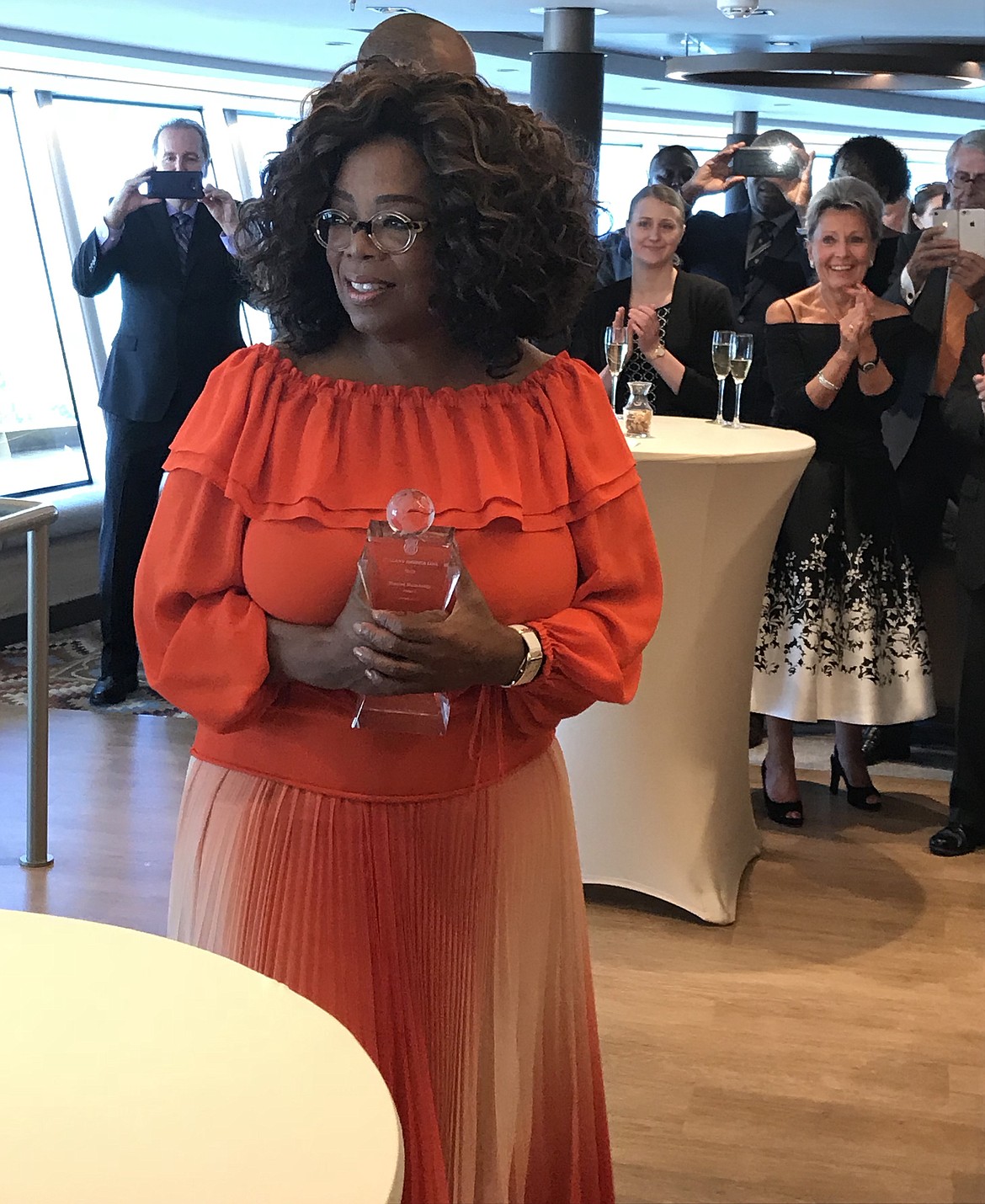 Oprah Winfrey receives the Shared Humanity Award from Holland America Line and a donation to her school for girls during a recent cruise to the Bahamas. Coeur d&#146;Alene blogger Shelley Webb, an O Mag Insider, was a guest on the cruise and got to meet Winfrey and attend a VIP reception with her. (Courtesy photo)