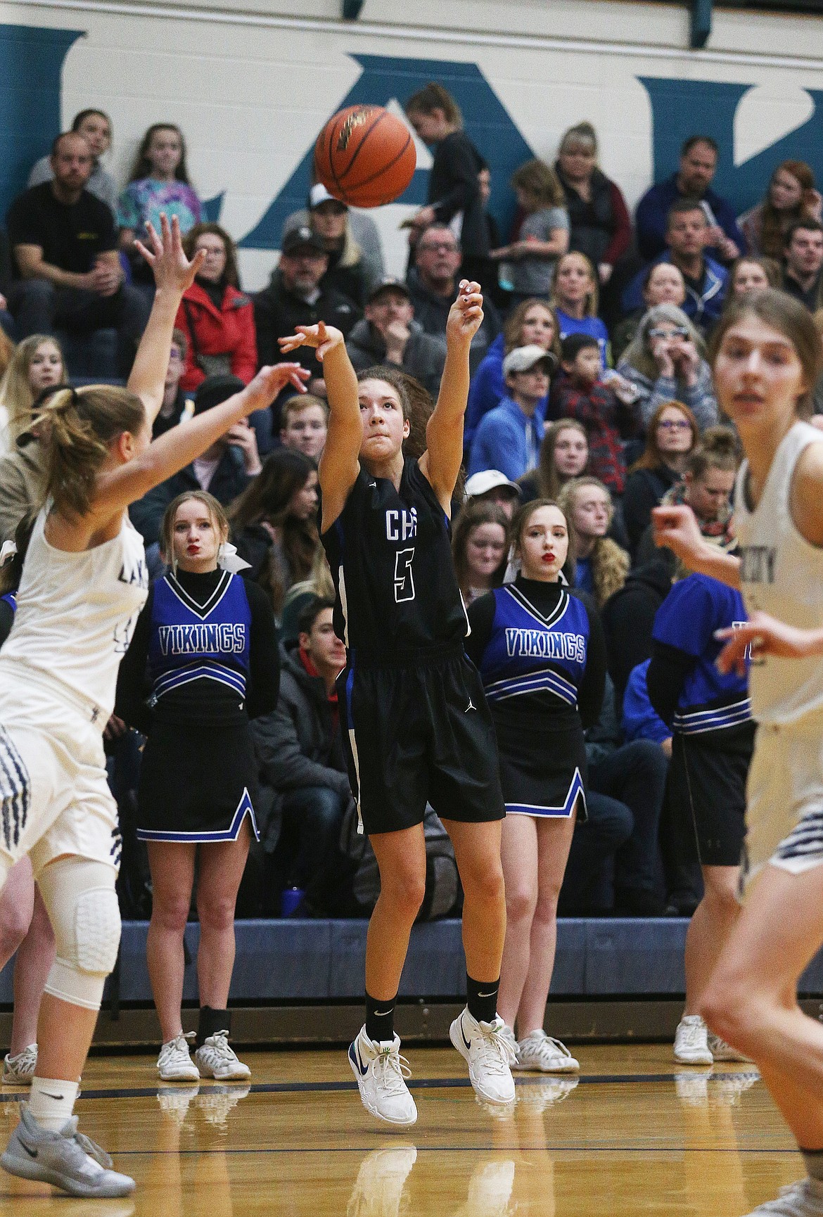 Coeur d&#146;Alene&#146;s Jaelyn Brainard-Adams shoots a three in the first half of Tuesday night&#146;s 5A Region 1 championship game against Lake City. (LOREN BENOIT/Press)