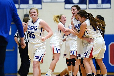 Columbia Falls celebrates after their win over Browning at Columbia Falls High School on Saturday. From left, are Trista Cowan, Madysen Hoerner and Lakia Hill. (Casey Kreider/Daily Inter Lake)