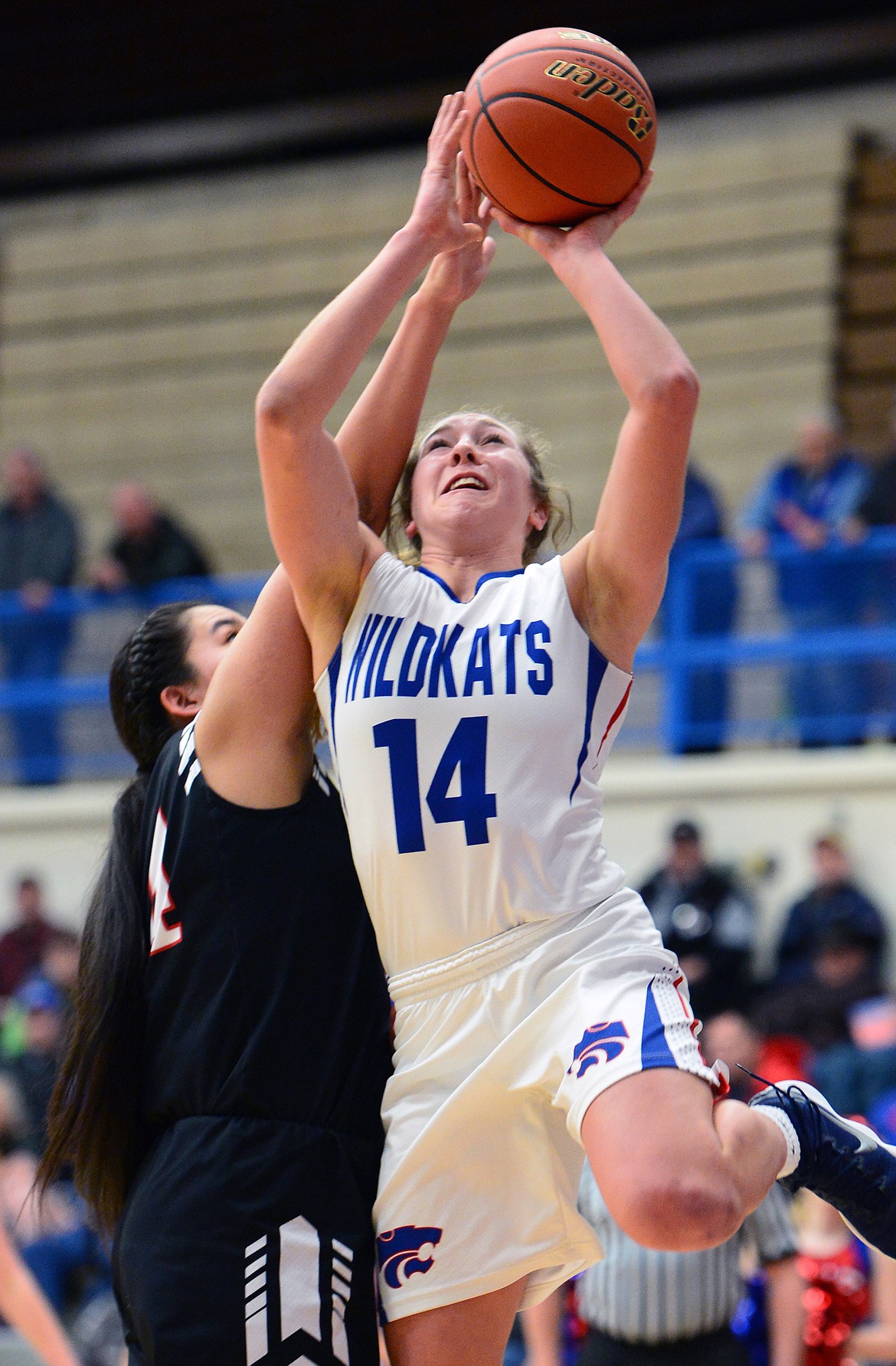 Columbia Falls' Josie Windauer (14) drives to the basket against Browning at Columbia Falls High School on Saturday. (Casey Kreider/Daily Inter Lake)