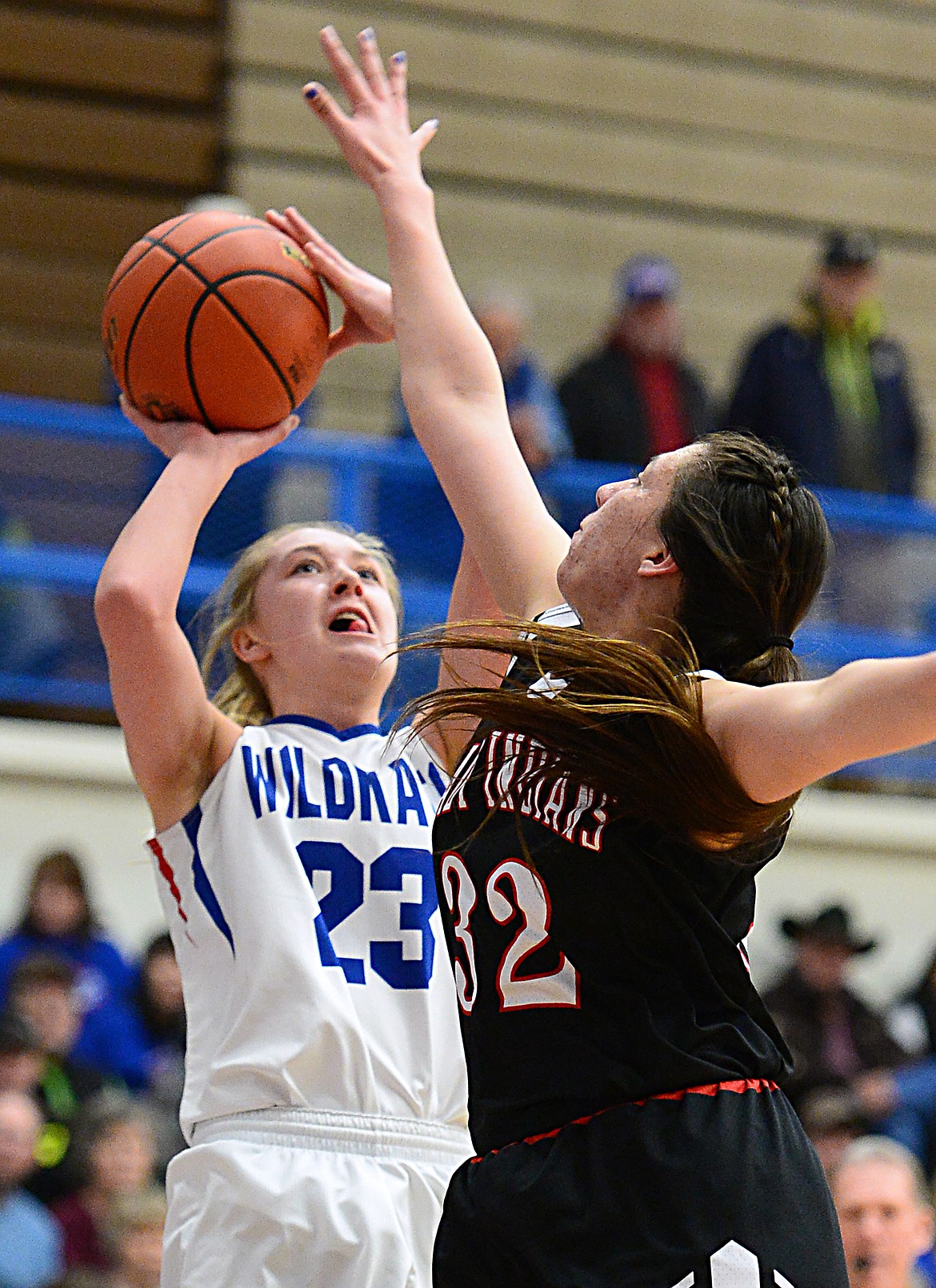 Columbia Falls' Ryley Kehr (23) shoots against Browning's Taylor Jordan (32) at Columbia Falls High School on Saturday. (Casey Kreider/Daily Inter Lake)