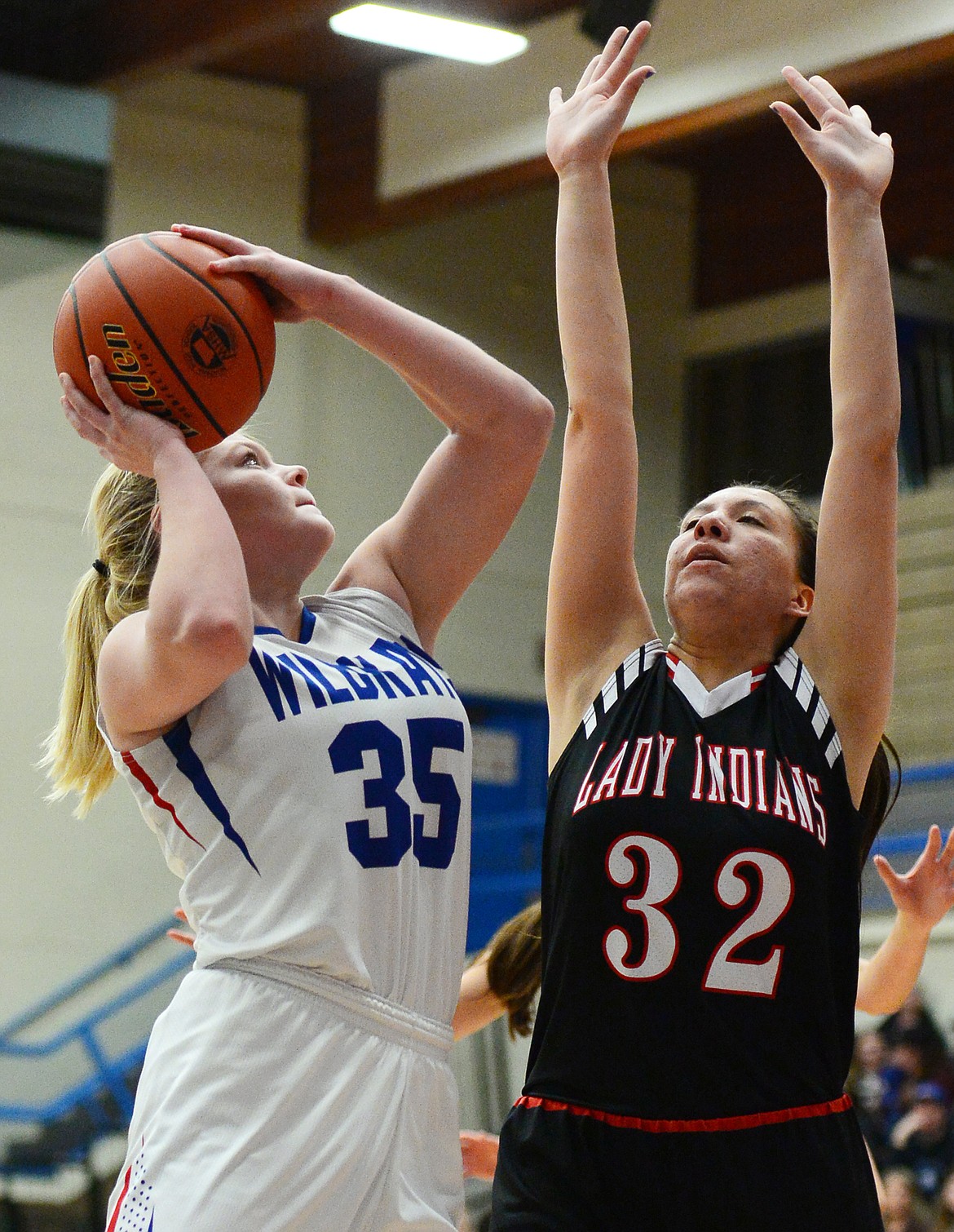 Columbia Falls' Trista Cowan (35) over Browning's Taylor Jordan (32) at Columbia Falls High School on Saturday. (Casey Kreider/Daily Inter Lake)