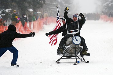Participants race down Sugar Hill during Barstool Ski Races at Cabin Fever Days in Martin City on Saturday. (Casey Kreider/Daily Inter Lake)