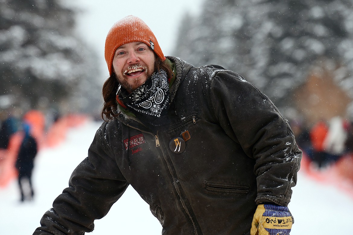 A racer smiles after he crosses the finish line during Barstool Ski Races at Cabin Fever Days in Martin City on Saturday. (Casey Kreider/Daily Inter Lake)