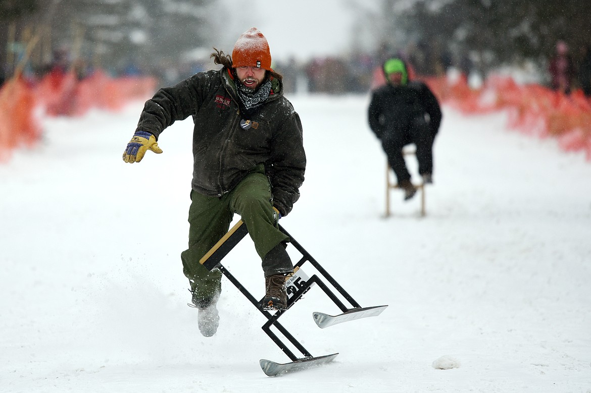Participants race down Sugar Hill during Barstool Ski Races at Cabin Fever Days in Martin City on Saturday. (Casey Kreider/Daily Inter Lake)
