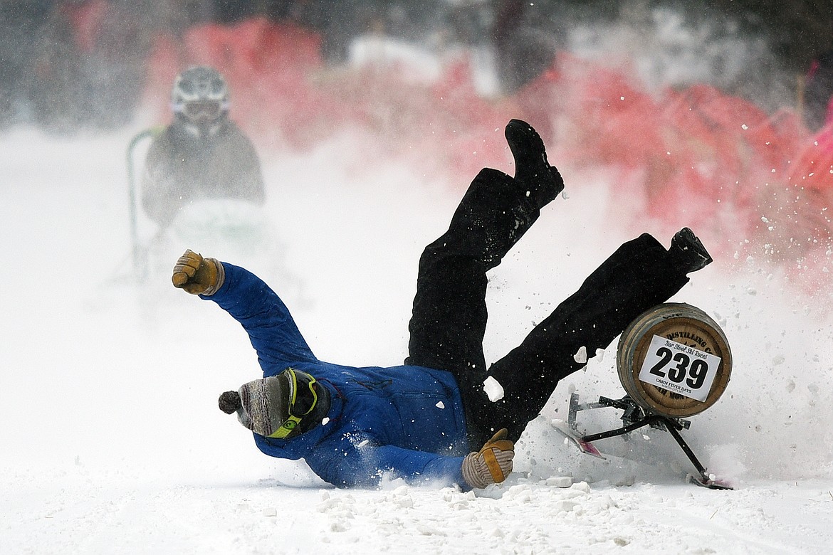 Participants race down Sugar Hill during Barstool Ski Races at Cabin Fever Days in Martin City on Saturday. (Casey Kreider/Daily Inter Lake)