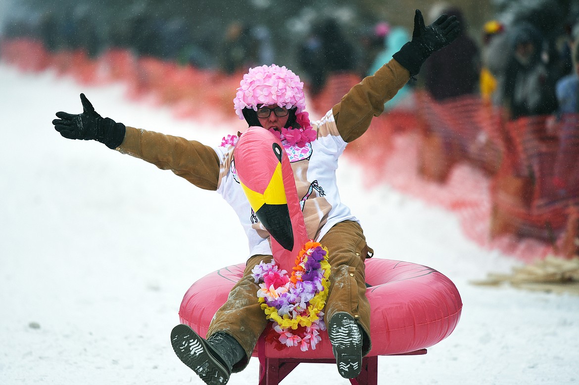 Participants race down Sugar Hill during Barstool Ski Races at Cabin Fever Days in Martin City on Saturday. (Casey Kreider/Daily Inter Lake)