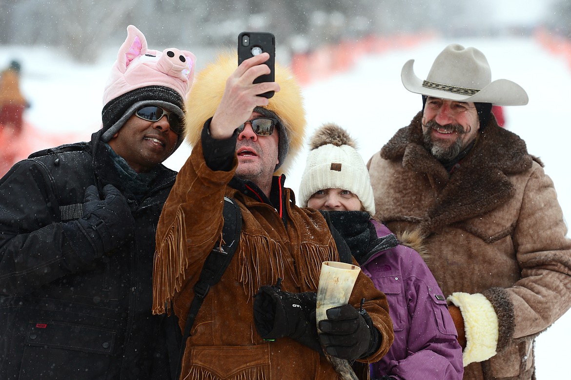 Attendees snap a selfie during Barstool Ski Races at Cabin Fever Days in Martin City on Saturday. (Casey Kreider/Daily Inter Lake)