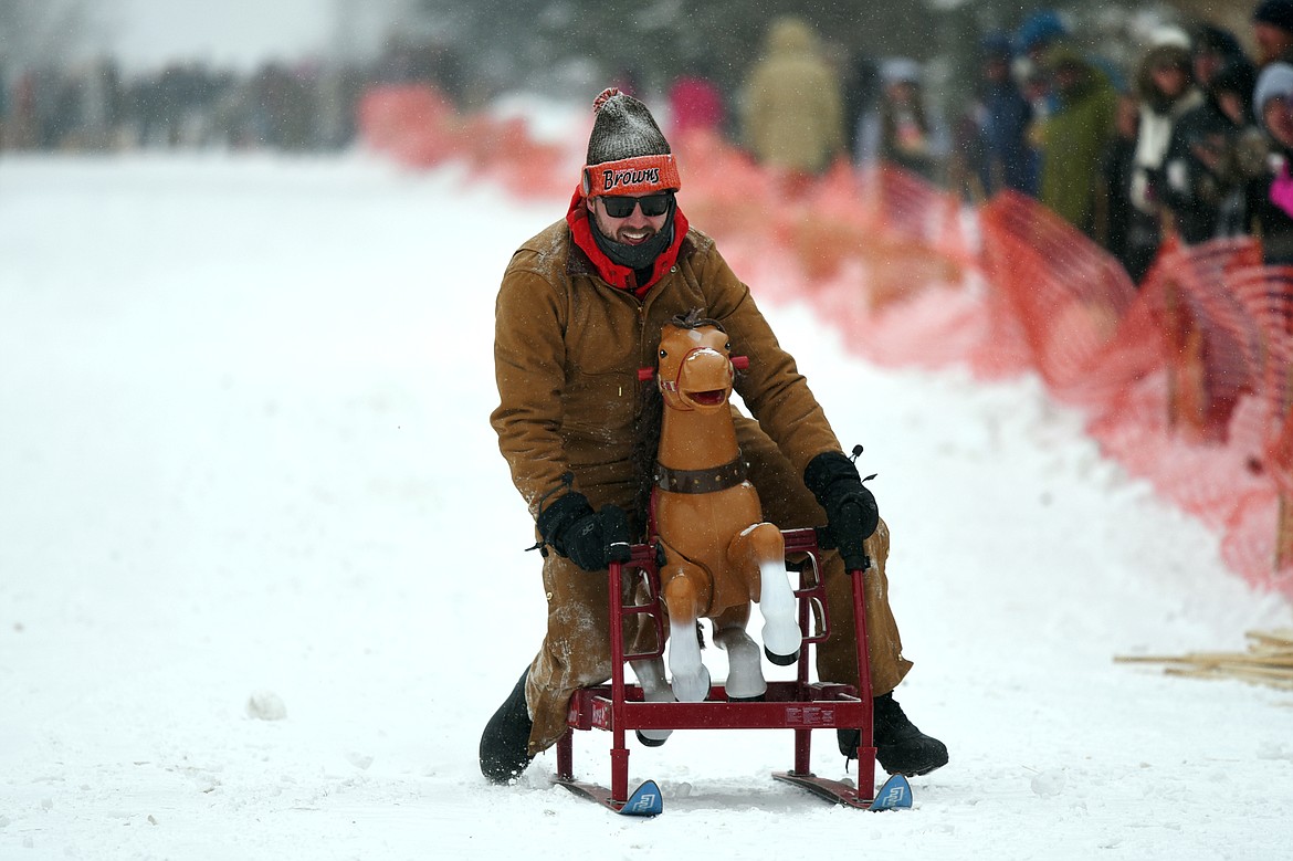 Participants race down Sugar Hill during Barstool Ski Races at Cabin Fever Days in Martin City on Saturday. (Casey Kreider/Daily Inter Lake)