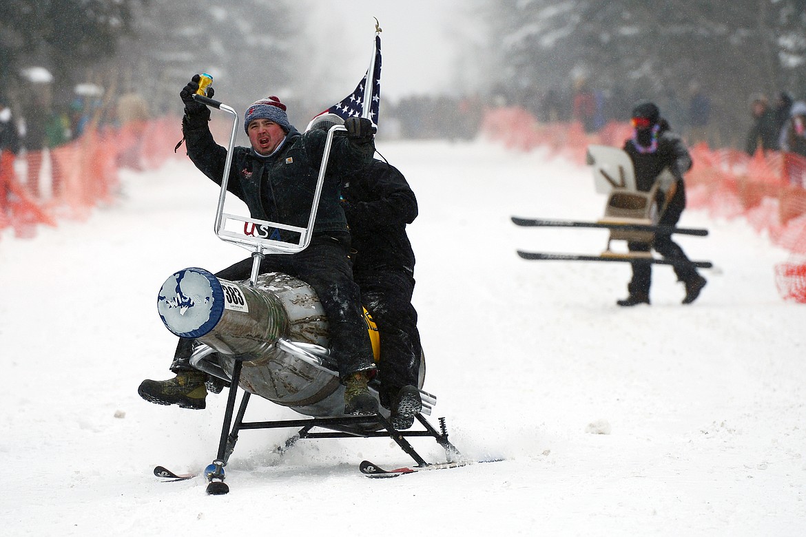 Participants race down Sugar Hill during Barstool Ski Races at Cabin Fever Days in Martin City on Saturday. (Casey Kreider/Daily Inter Lake)