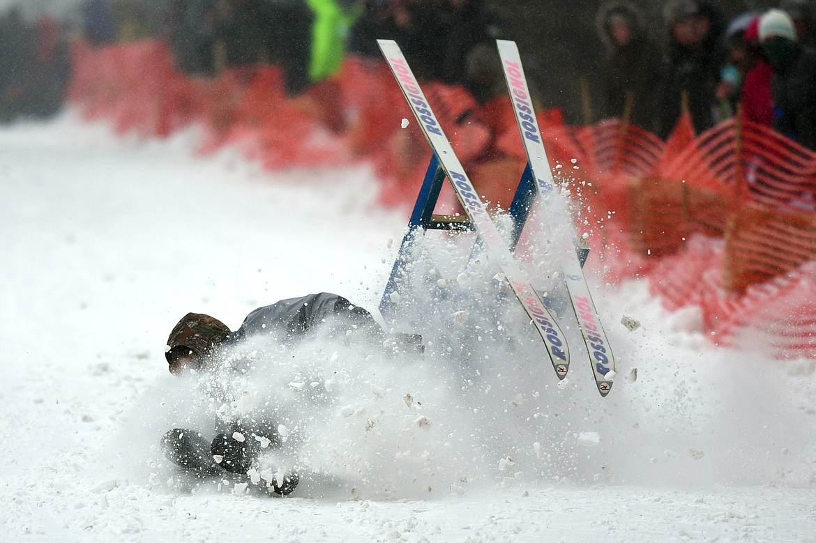 A racer takes a spill during Barstool Ski Races at Cabin Fever Days in Martin City on Saturday. (Casey Kreider/Daily Inter Lake)