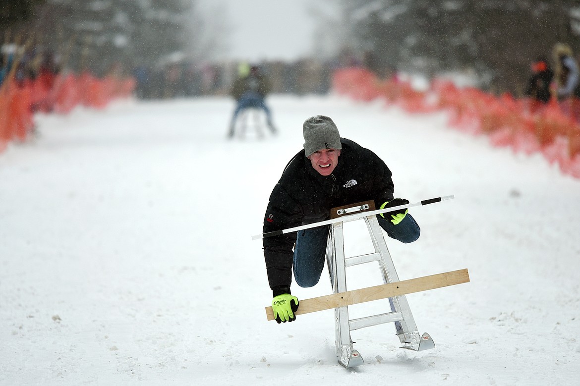 Participants race down Sugar Hill during Barstool Ski Races at Cabin Fever Days in Martin City on Saturday. (Casey Kreider/Daily Inter Lake)