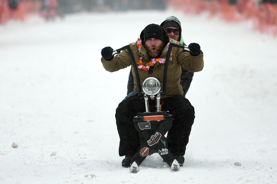 Participants race down Sugar Hill during Barstool Ski Races at Cabin Fever Days in Martin City on Saturday. (Casey Kreider/Daily Inter Lake)