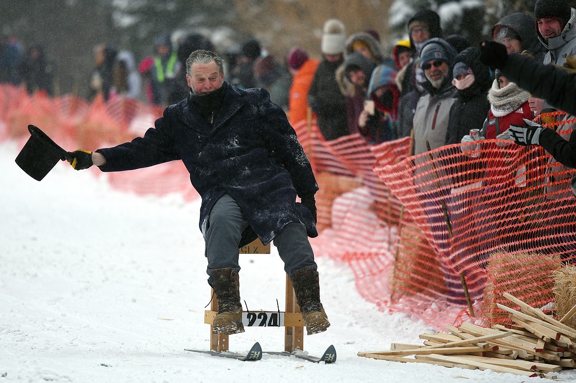 Participants race down Sugar Hill during Barstool Ski Races at Cabin Fever Days in Martin City on Saturday. (Casey Kreider/Daily Inter Lake)