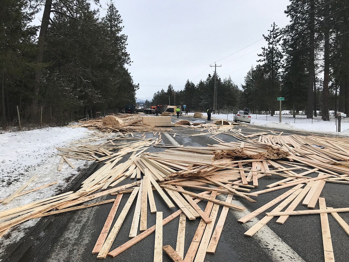 Courtesy of NORTHERN LAKES FIRE DISTRICT
Lumber covers the roadway after a crash Monday at the intersection of Atlas Road and Highway 53 near Rathdrum.