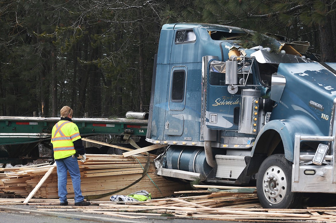 Traffic on Highway 53 was delayed for a couple hours due to a semi-trailer crash near the intersection of Atlas Road on Monday. Roger Schroeder&#146;s rear trailer rolled over, spilling a full load of lumber. (LOREN BENOIT/Press)