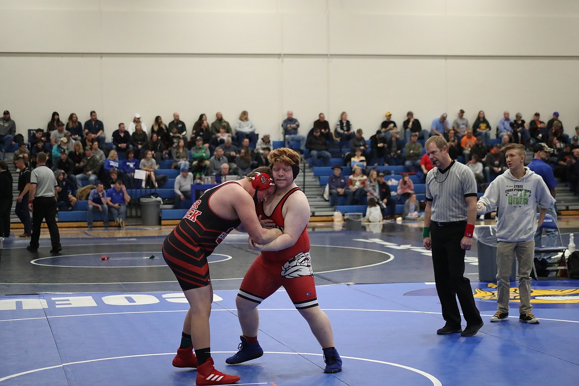 (Photo by KYLE CAJERO)
SHS wrestler Evan Twineham grapples with a Moscow wrestler during the North Idaho Rumble on Jan. 26.