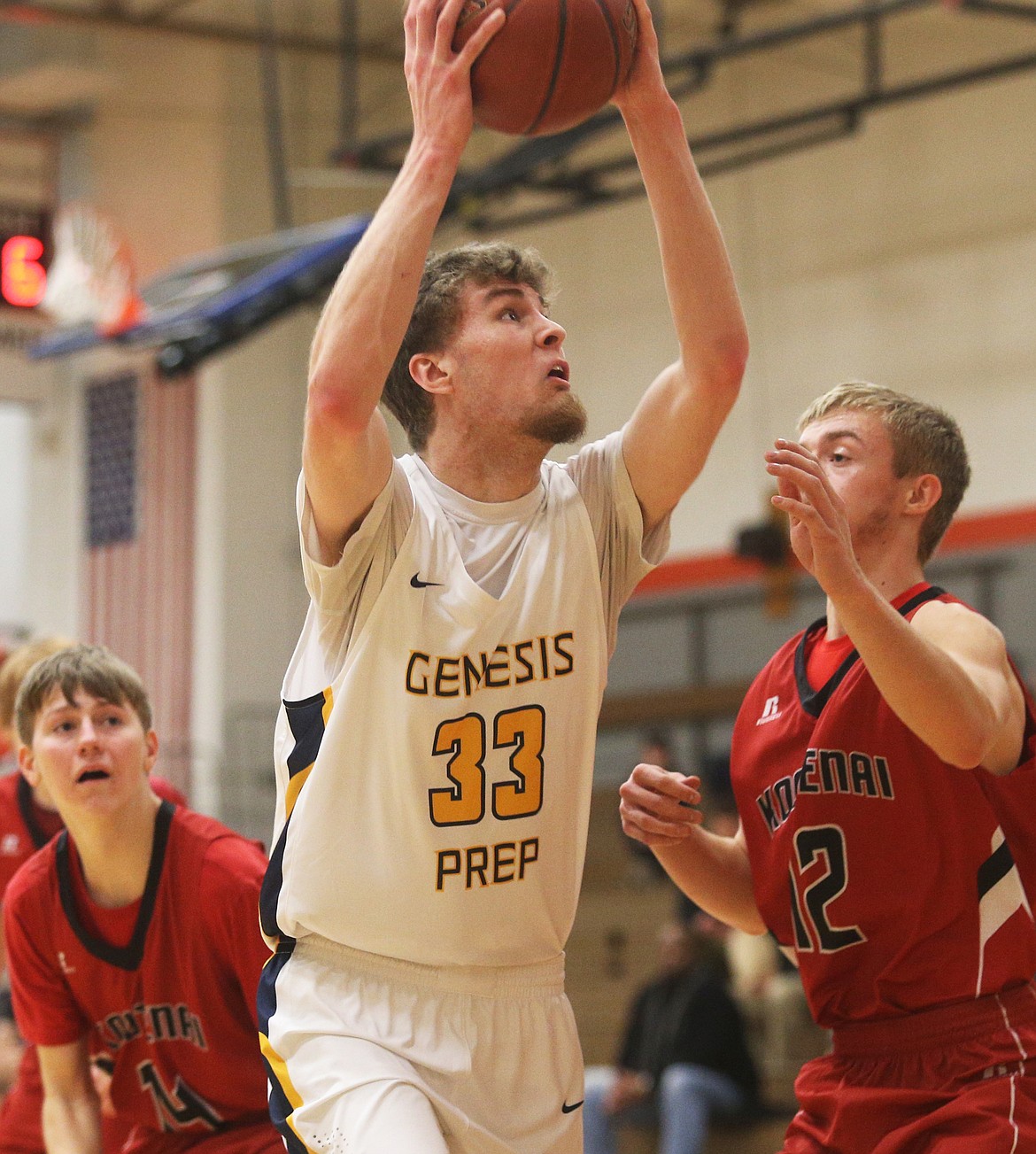 Genesis Prep center Joshua Bohannan goes up to the basket against Kootenai.